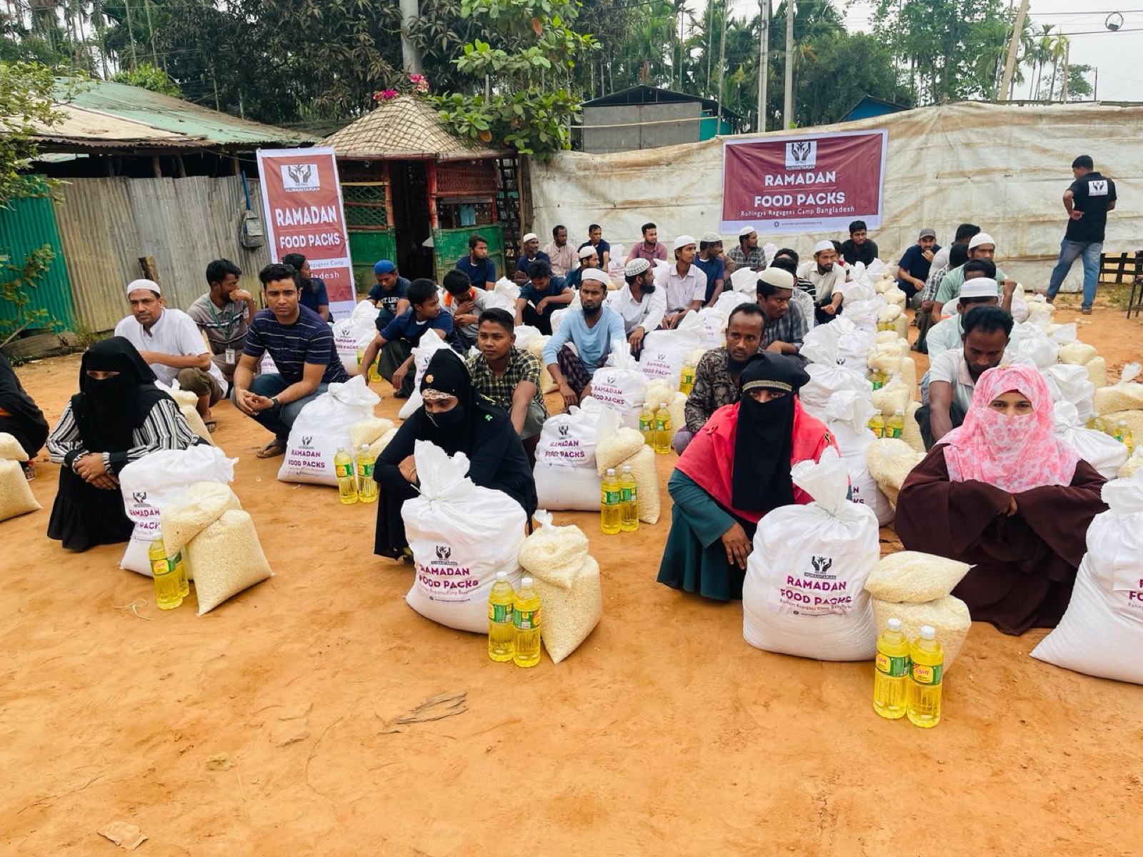 A family receiving food assistance from Being Humanitarian