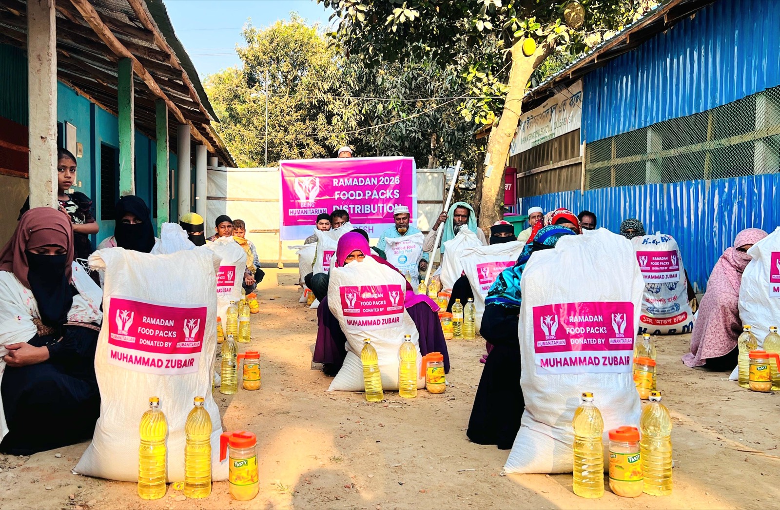 Being Humanitarian team distributing Ramadan food packs